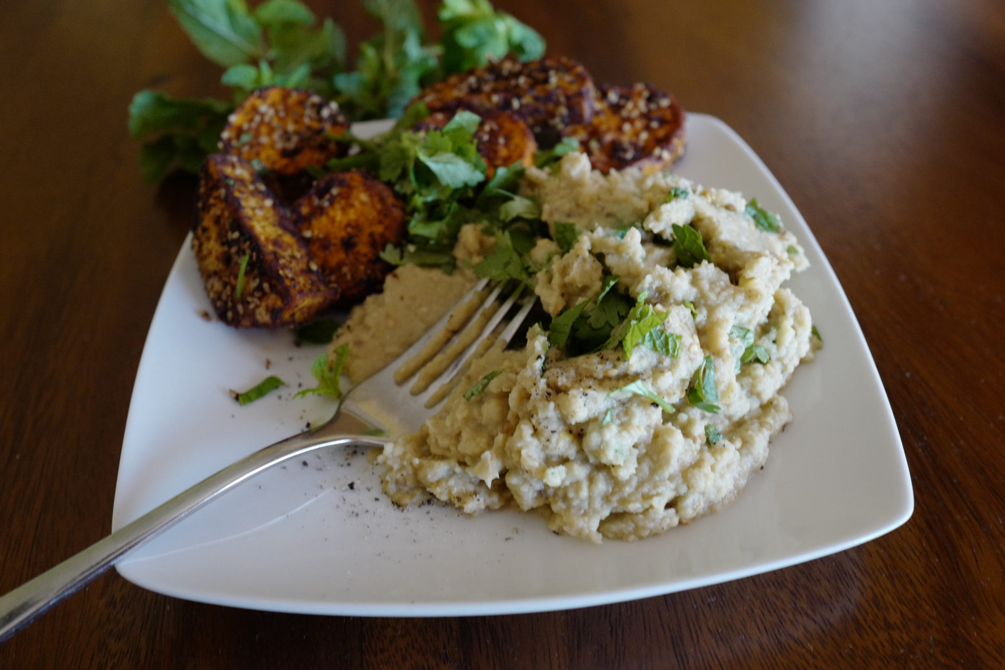 Sesame sweet potato wedges with mashed eggplant, chickpeas, and herbs by Foodjoya