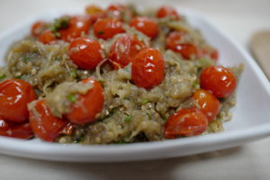 Eggplant Caviar (French) with Thyme-Roasted Tomatoes and Herbs (Paleo, Vegan, Keto, Plant-based) in a white dish on a beige tablecloth by Foodjoya.