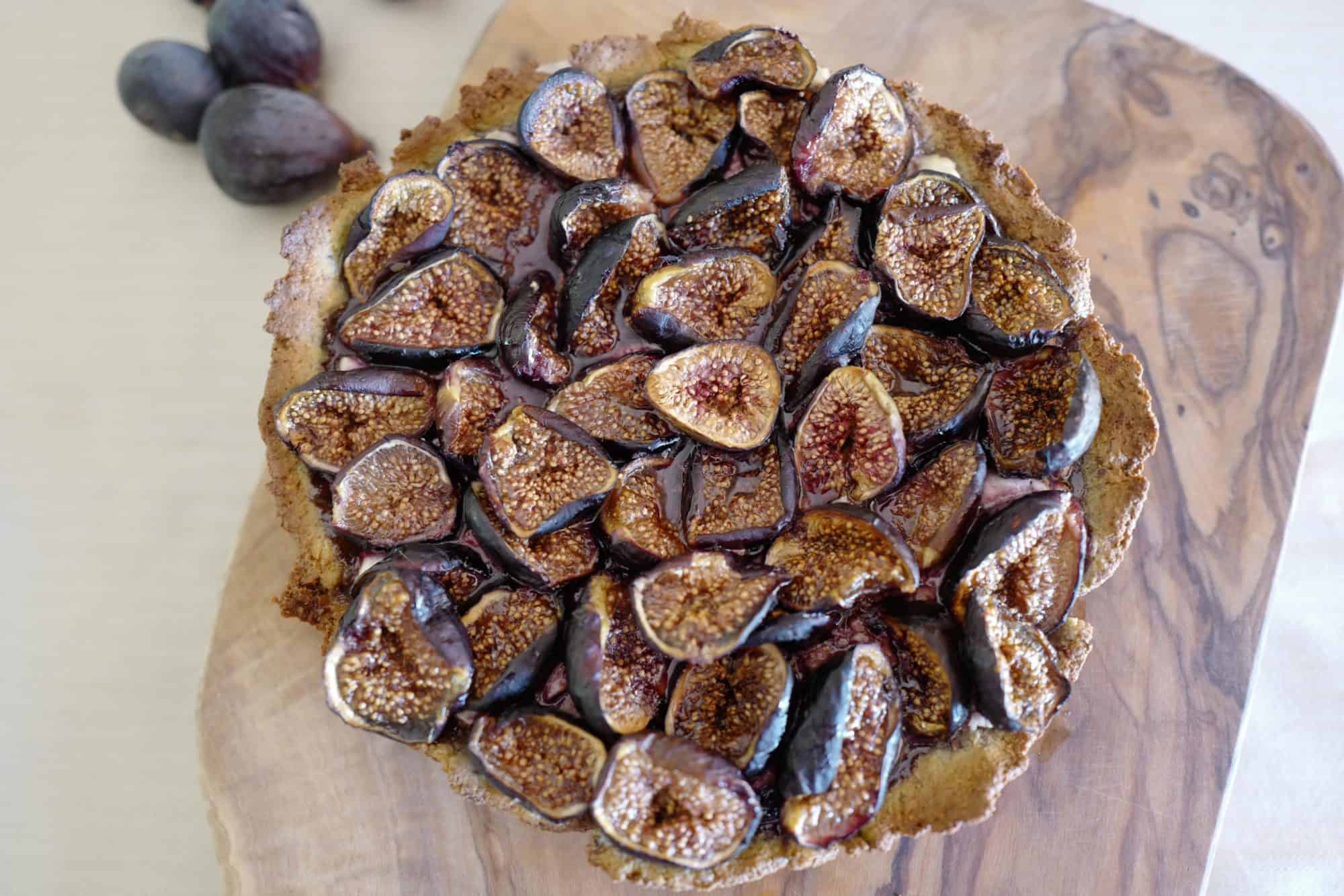 Top down view of Paleo Fig Tart (sugar-free, nutrient-dense) with goat cheese and almond-pistachio crust by Foodjoya