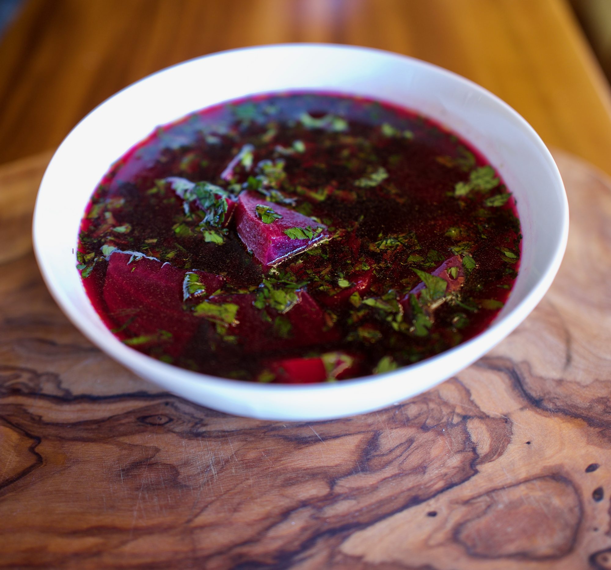 Polish Red Beet Soup, Polish Borscht Recipe, vegan beet soup with carrots parsnip parsley in a bowl by foodjoya